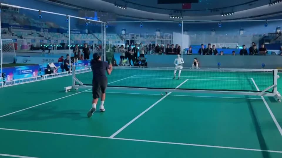 Humanoid Robots Play Tennis at the World Humanoid Robot Games in Beijing